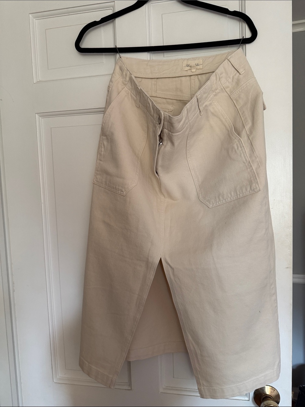 Women’s cream mid- length skirt with front slit detail
